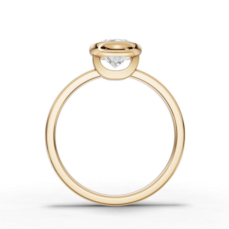 Oval bezel lab-grown ring yellow gold close-up