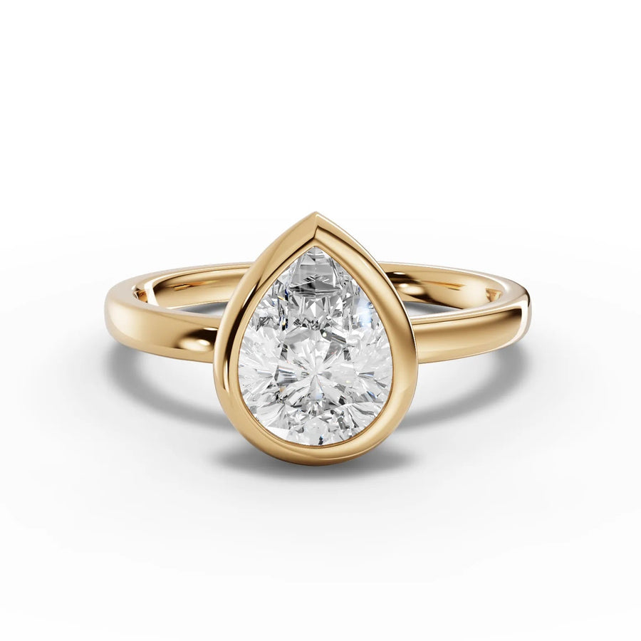 Pear bezel diamond ring yellow gold angle