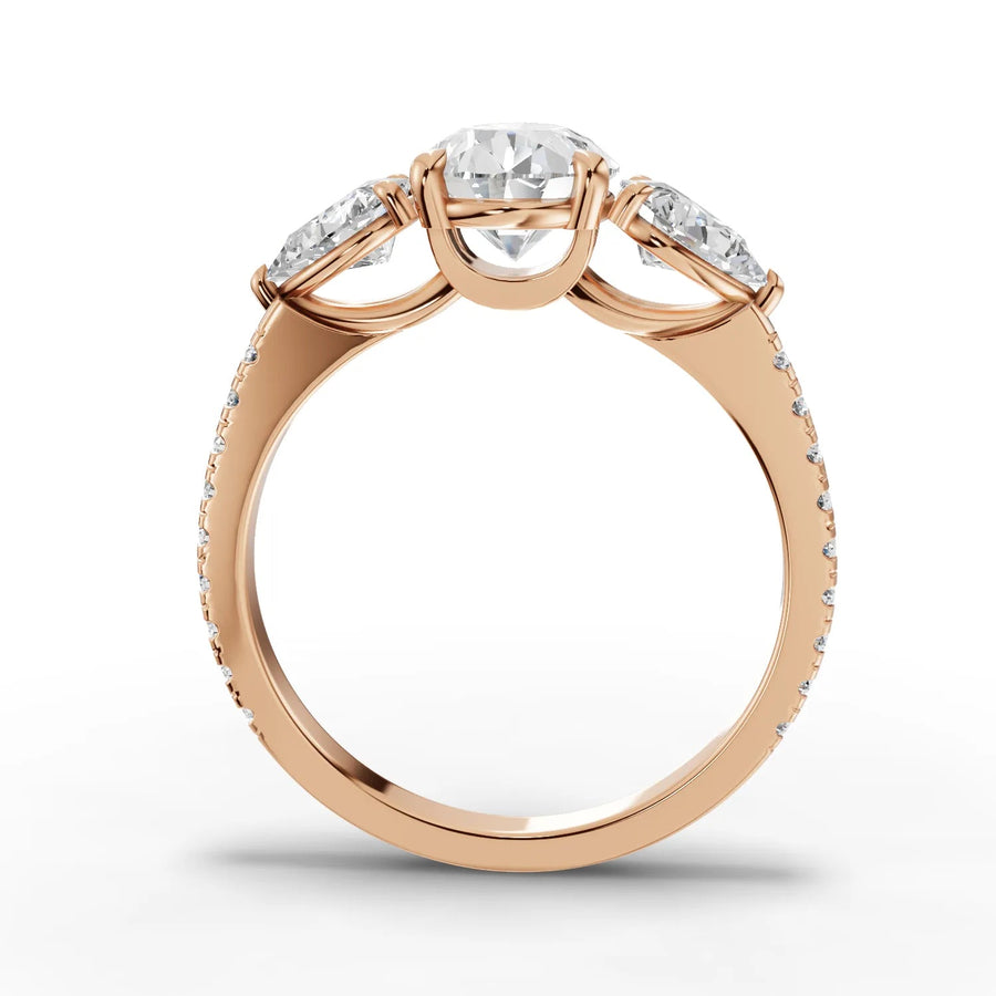 Pear lab-grown three stone ring rose gold close-up