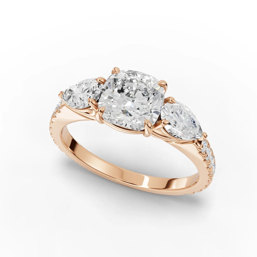 Cushion three-stone ring rose gold angle