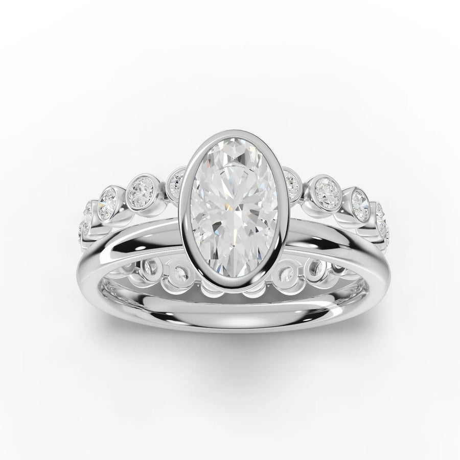 1.63 Ct oval lab grown diamond bezel ring with a polished 18K gold band and bezel-set side stones for added brilliance.