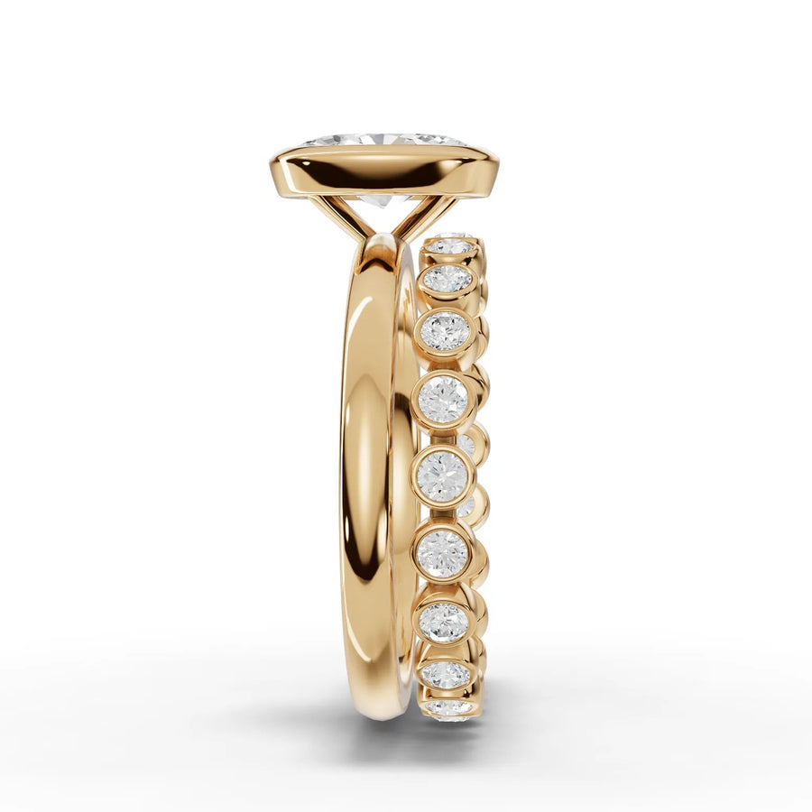 1.63 Ct oval solitaire ring with a bezel setting, featuring a polished 18K gold band and side bezel-set diamonds.