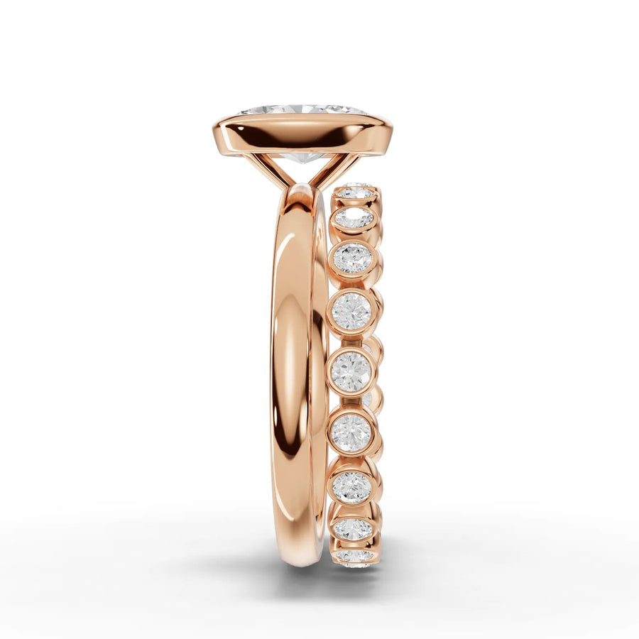 1.63 Ct oval solitaire lab diamond bezel ring in polished 18K rose gold, features a prong-set center and bezel-set side stones.