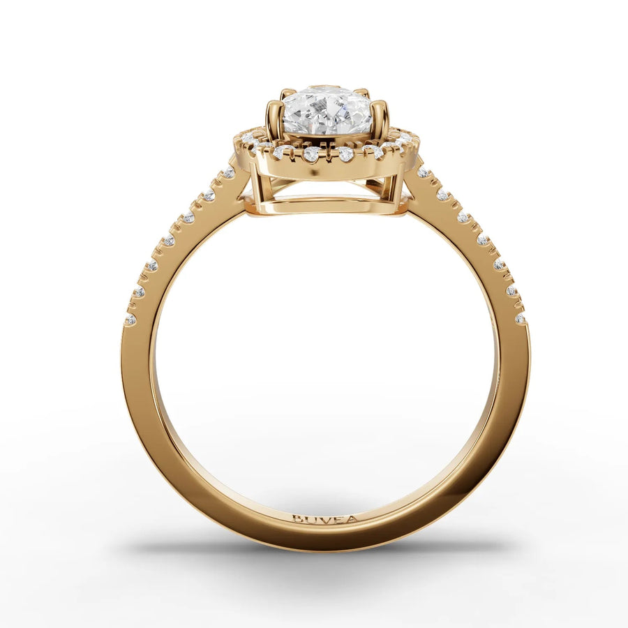 Pear center halo ring yellow gold close-up