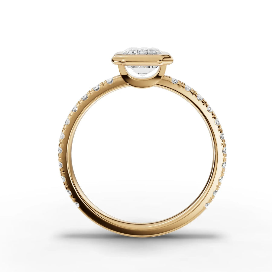 Emerald bezel lab-grown ring yellow gold close-up