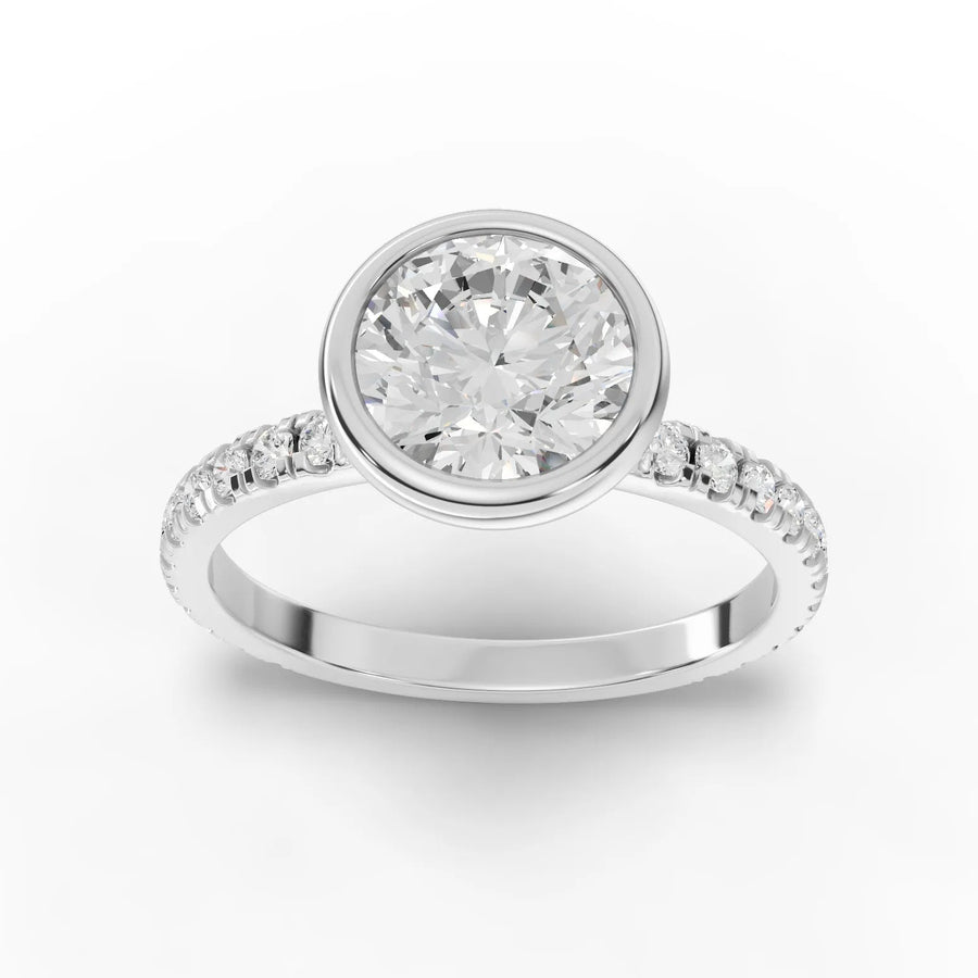 1.84 CT bezel pavé lab-grown diamond ring with 1.50 CT round center stone and accent diamonds on the band