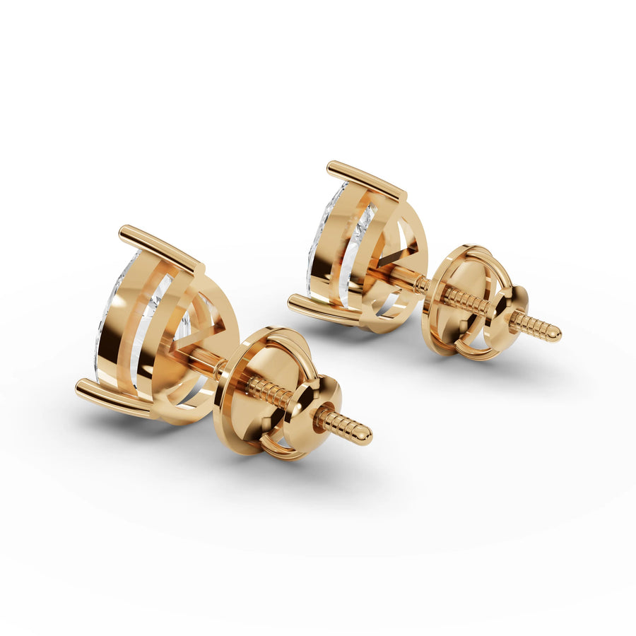 Pear lab-grown stud earrings yellow gold close-up