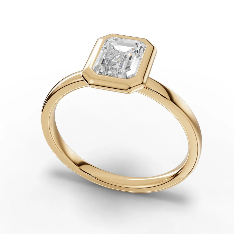 Emerald bezel diamond ring yellow gold angle