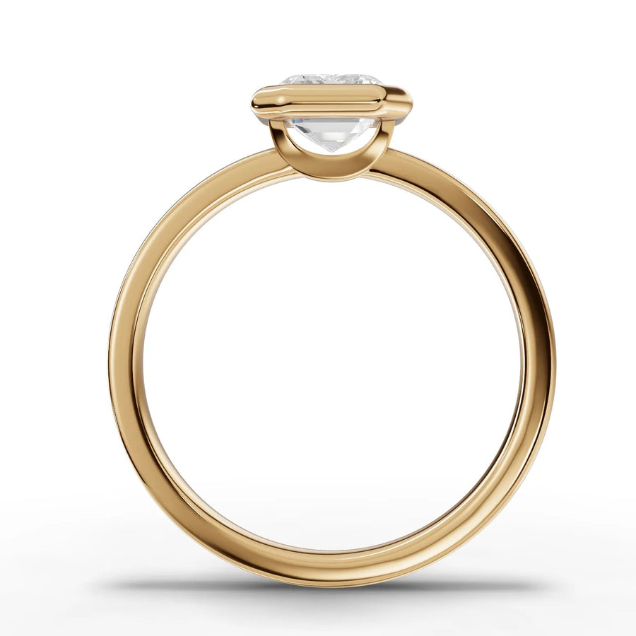 Emerald bezel lab-grown ring yellow gold close-up