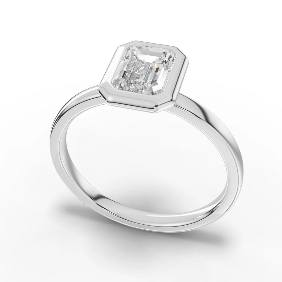 Emerald bezel diamond ring white gold angle