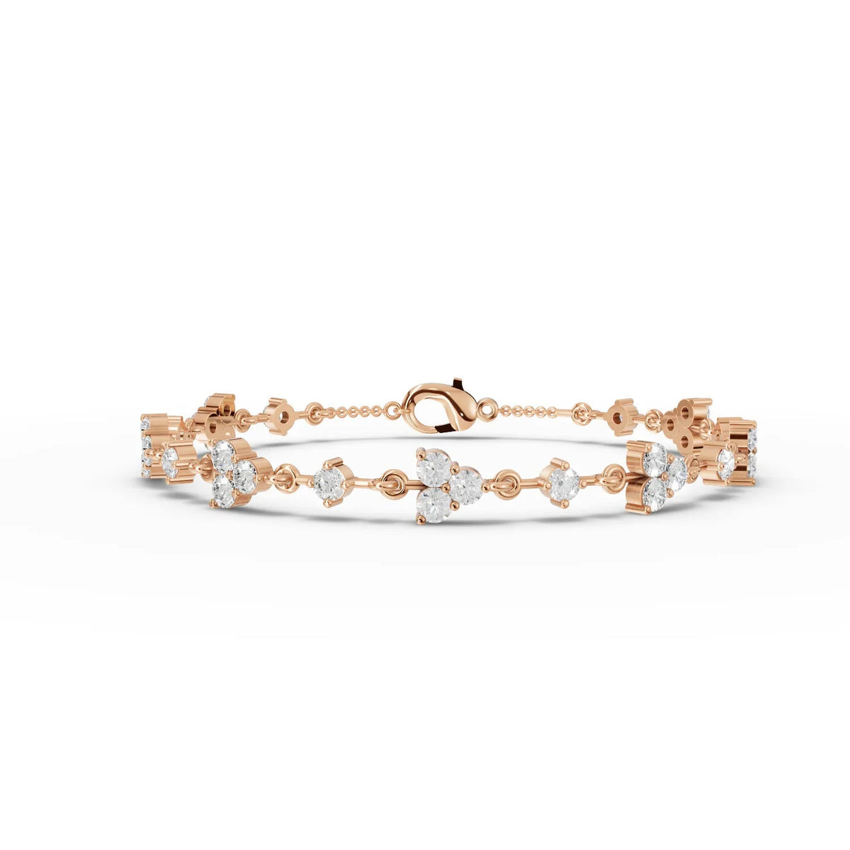 Delicate 18K gold bracelet featuring round lab grown diamonds in floral cluster designs, secured with a lobster clasp.