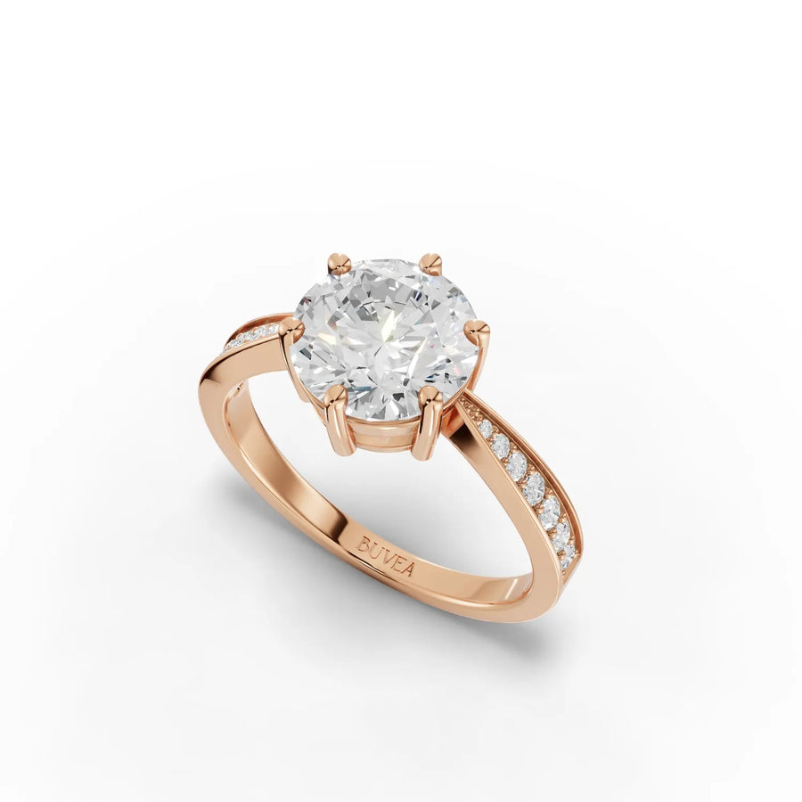 Solitaire ring tapered side stones rose gold angle