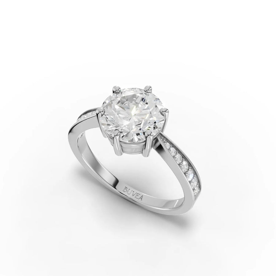 Solitaire ring with tapered side stones white gold angle