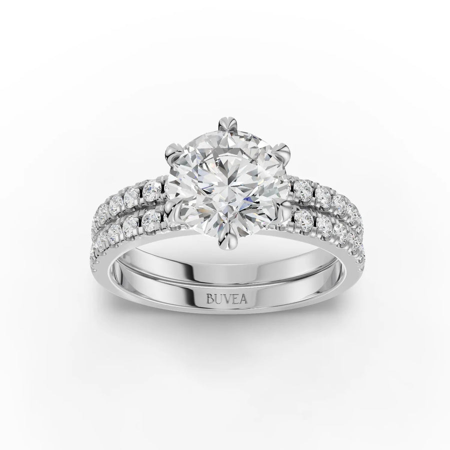 Lab grown diamond ring featuring a 1.5 Ct round center stone, surrounded by double rows of accent diamonds on a gold band.