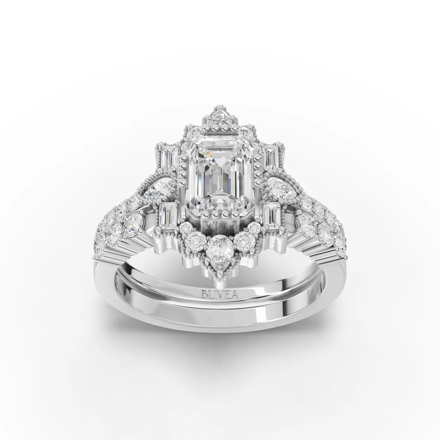2.56 CT emerald halo lab diamond ring with 1 CT emerald center, baguette, round and pear accents in 18K gold