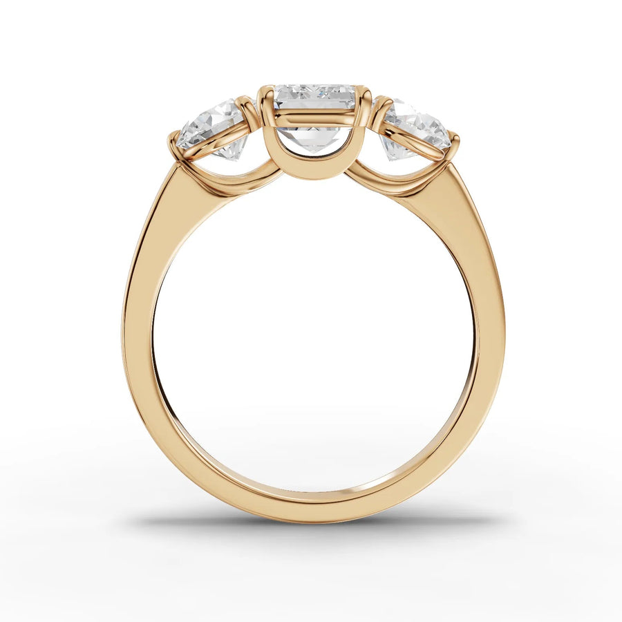 Emerald trinity lab-grown ring yellow gold close-up