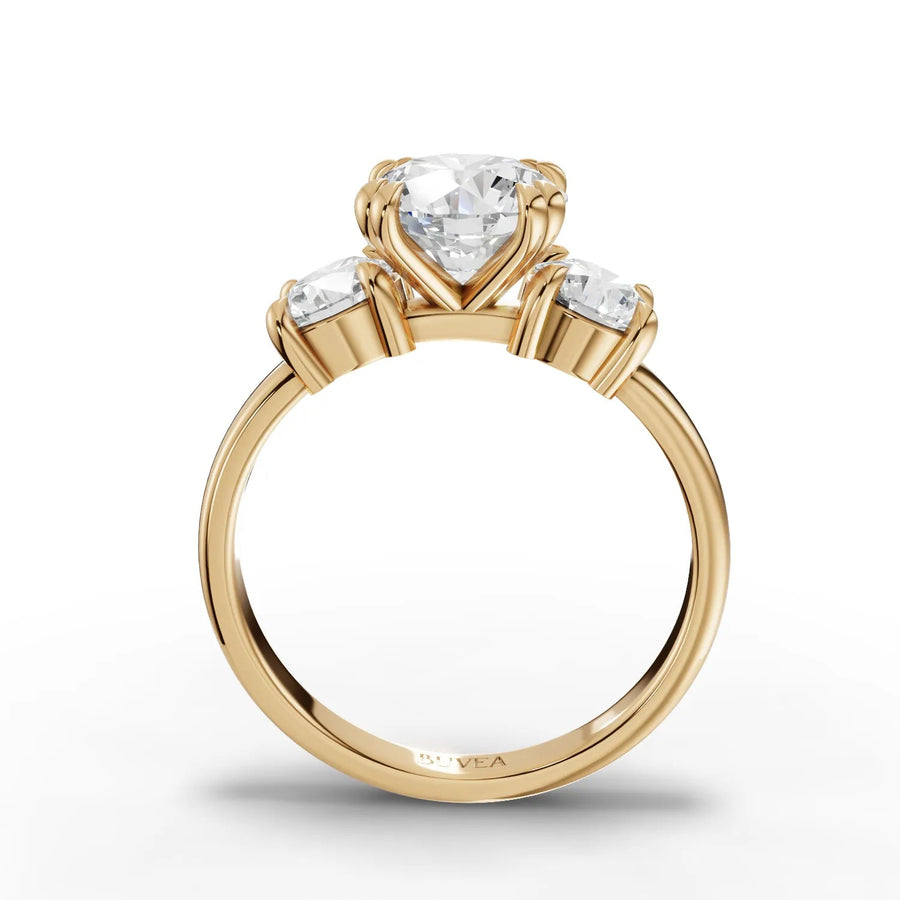 Round diamond trio ring yellow gold close-up view