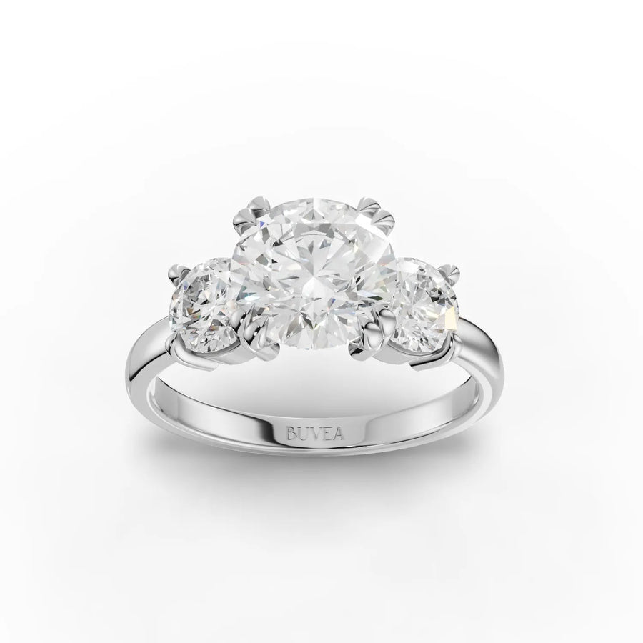2.50 CT round three stone lab diamond ring with 1.50 CT center diamond in prong setting on a gold band