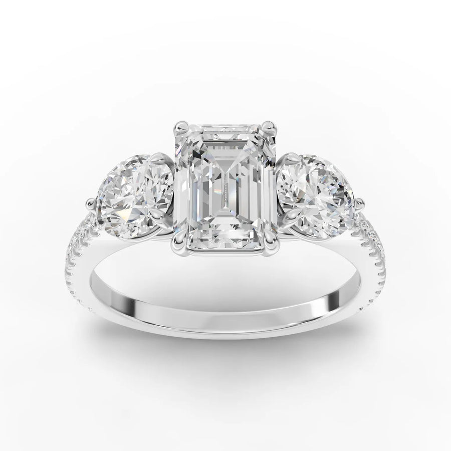 2.72 ct emerald three-stone pavé lab diamond ring with 1.50 ct center and round side diamonds
