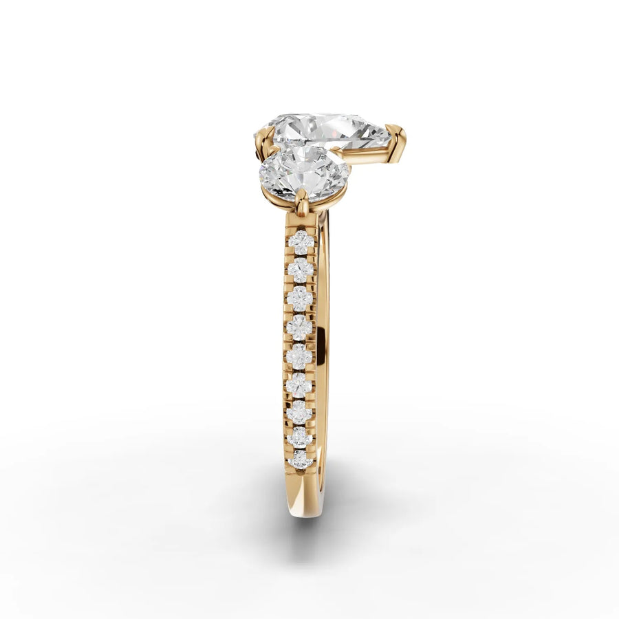 Pear lab-grown trinity ring yellow gold close-up