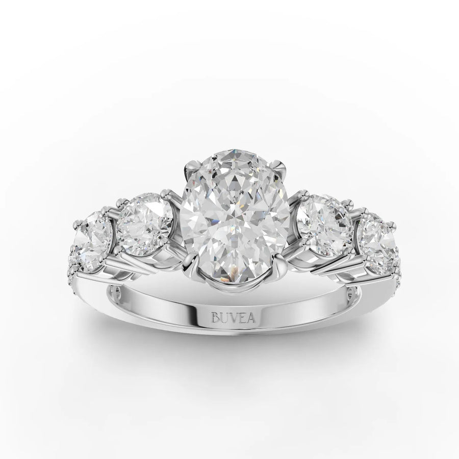 2.20 CT oval lab diamond ring with 1 CT center stone, round accent diamonds, four-prong setting, and 18K gold band