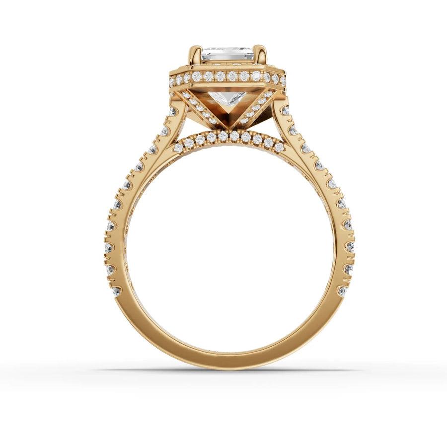 Emerald center halo ring yellow gold close-up