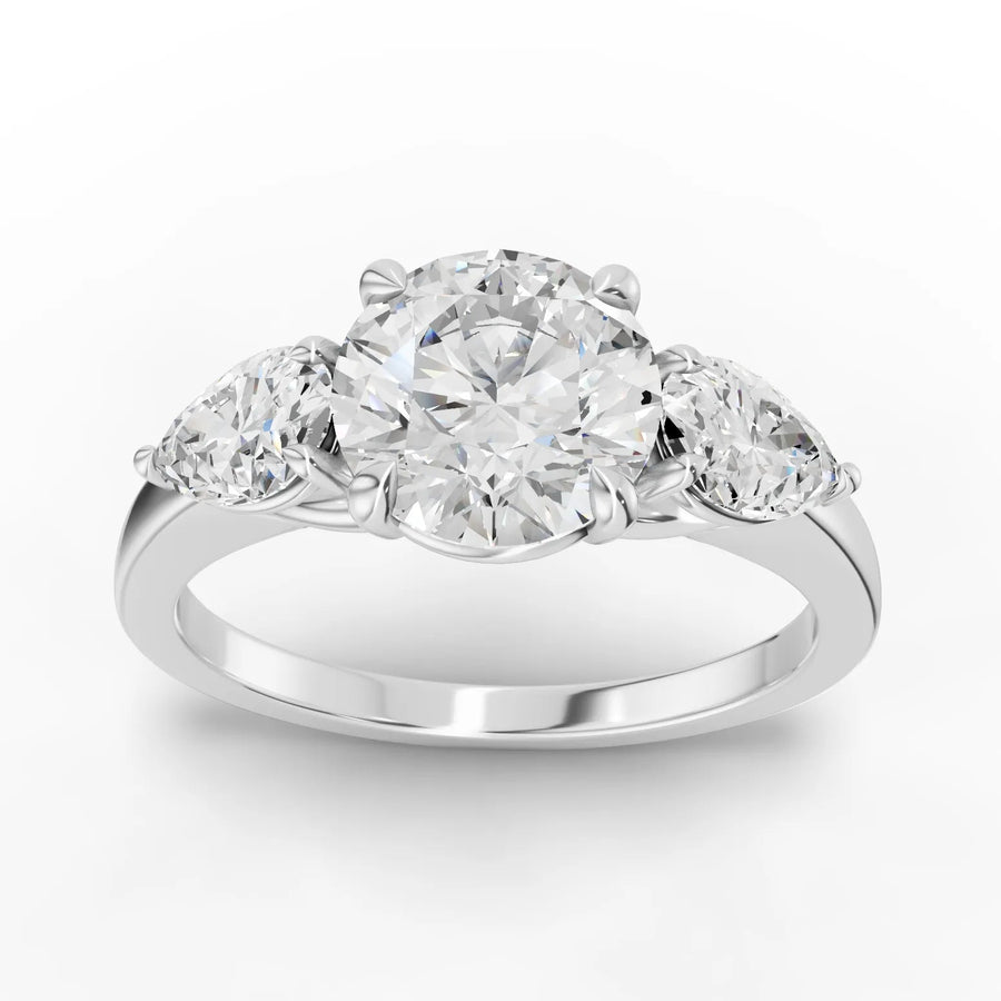 2.50 ct round and pear three-stone lab diamond ring with 1.50 ct round center in polished gold