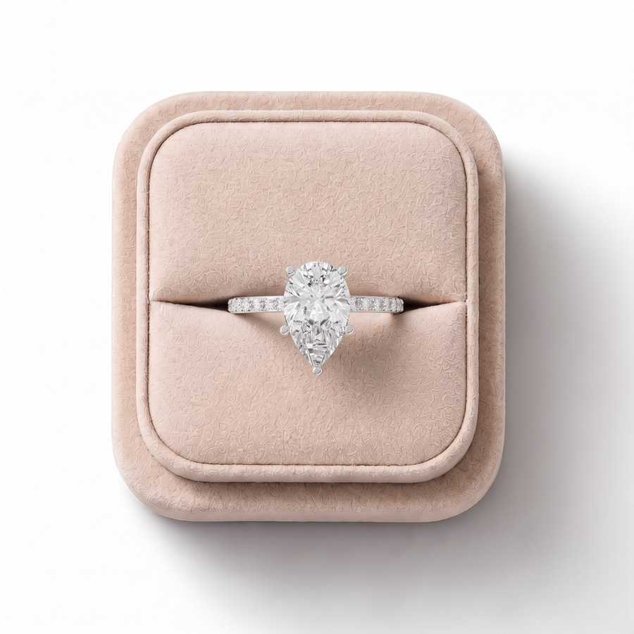 3.37 CT Pear Solitaire Pavé Lab Grown Diamond Engagement Ring, on a white background