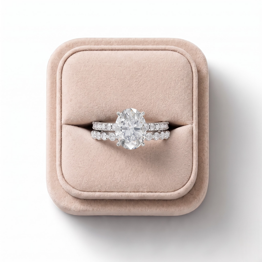3.38 CT Oval Solitaire with Matching Pavé Lab Grown Diamond Band Set, on a white background
