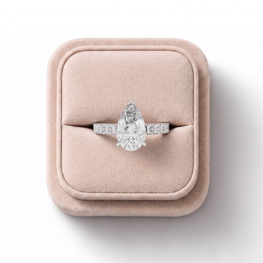 3.50 CT Pear Lab Grown Diamond Engagement Ring with Princess Accent Band in white gold, on a white background