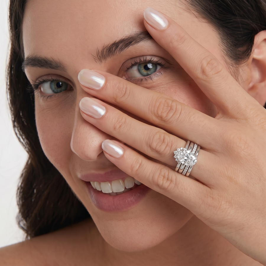3.91 CT Oval With Side Band Lab Grown Diamond Bridal Set, worn on the hand