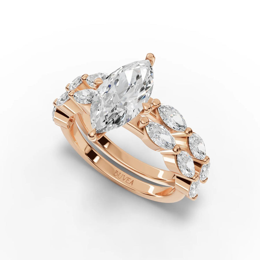 2.84 Ct marquise solitaire ring in rose gold, featuring a 1.5 Ct center stone with round diamond accents along dual bands.
