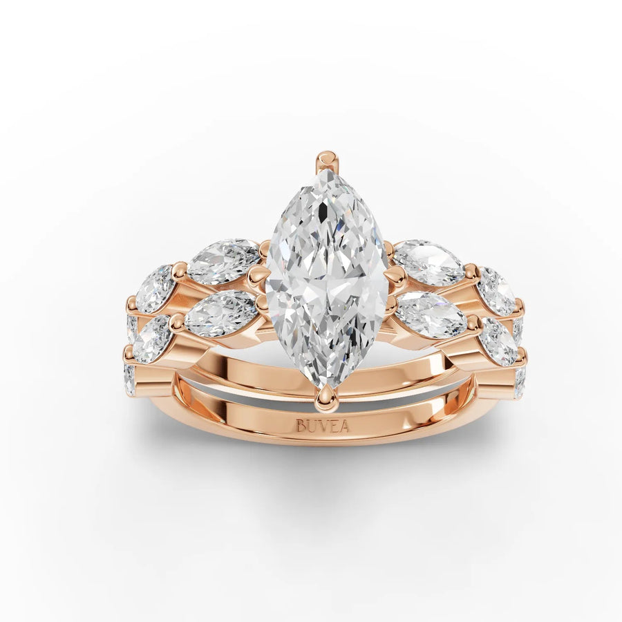 Lab grown diamond ring featuring a 1.5 Ct marquise center stone, flanked by round diamonds on a dual-band rose gold setting.