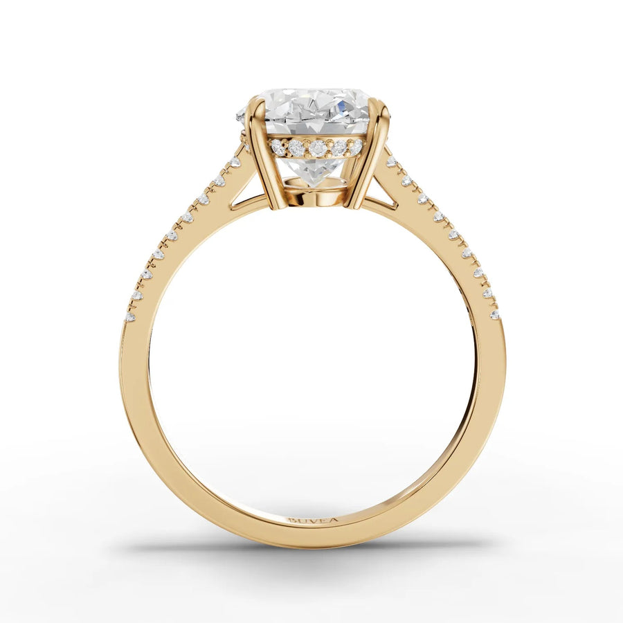 Oval center pavé band ring yellow gold close-up