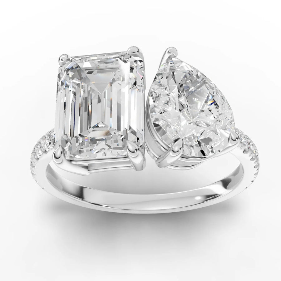 3.10 ct toi et moi lab diamond ring with emerald-cut and pear-shaped stones on a pavé band