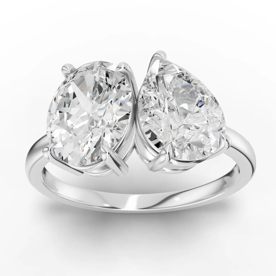 2.5CT Oval & Pear Toi et Moi lab-grown diamond ring with 1.50 CT oval and 1.00 CT pear diamonds on a gold band