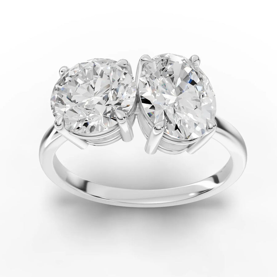 3.00 CT round oval toi et moi lab diamond ring with 1.50 CT round and 1.50 CT oval stones on a polished gold band