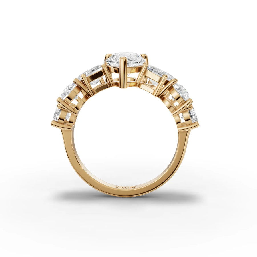 Pear center ring yellow gold close-up