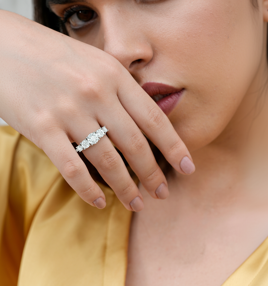 2.44 CT round five stone lab-grown diamond ring worn on hand
