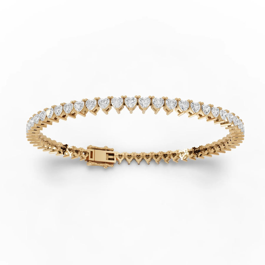 Lab-grown heart tennis bracelet yellow gold close-up