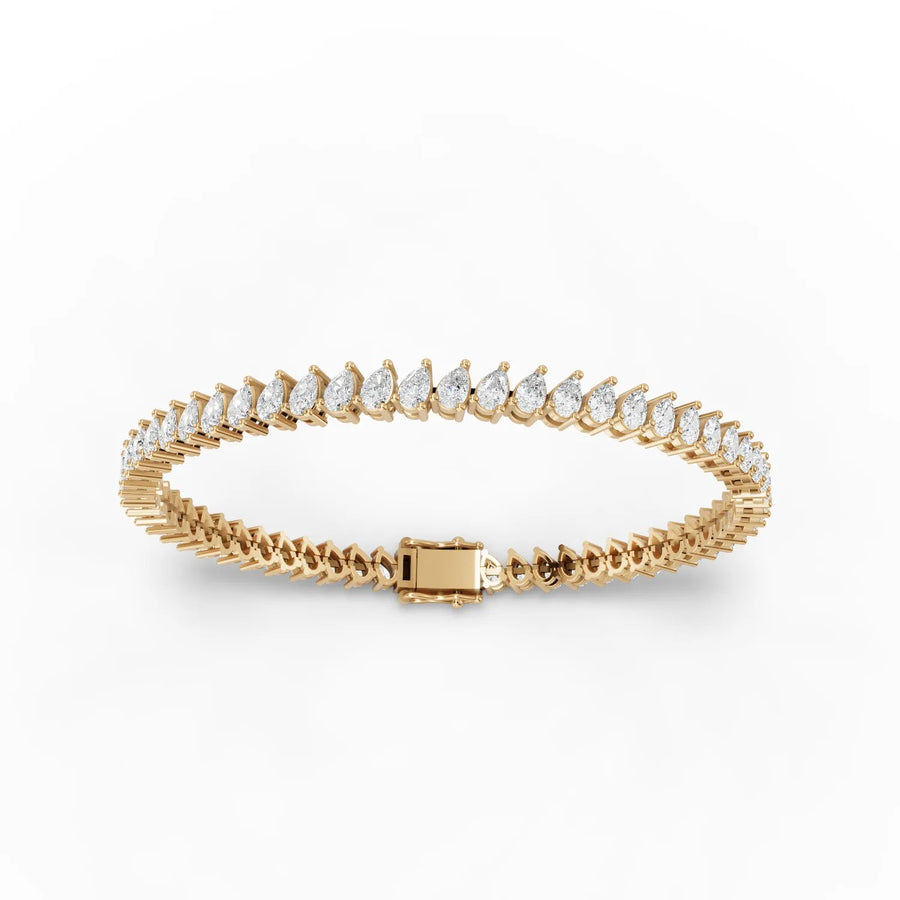 Lab-grown pear tennis bracelet yellow gold close-up