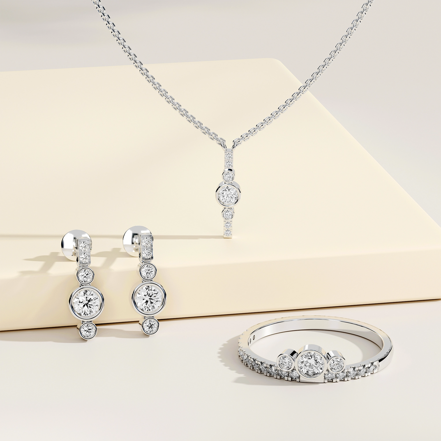 1.29 ct bezel lab diamond jewellery set with bar pendant, drop earrings and three-stone pavé ring