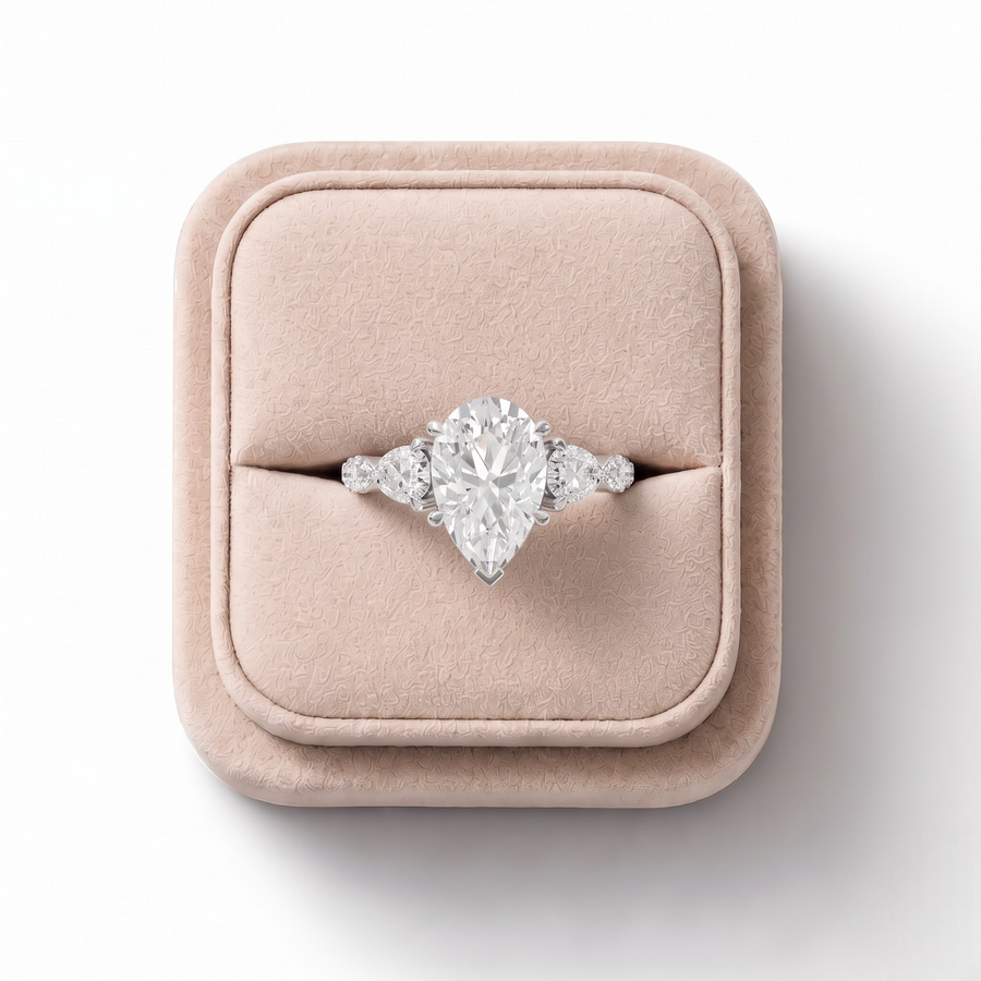3.82 Ct Pear Three-Stone Lab Grown Diamond With Side Stone Ring