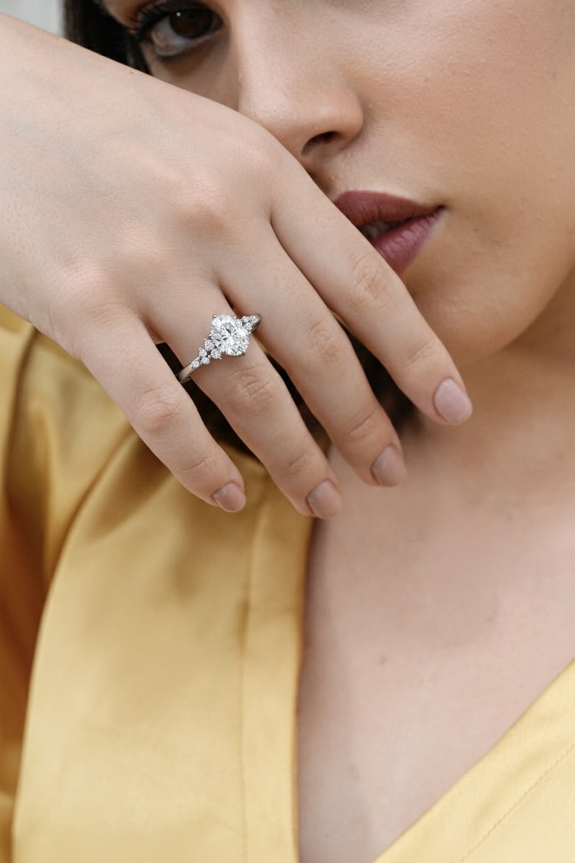 1.38 CT oval lab-grown diamond engagement ring worn on hand