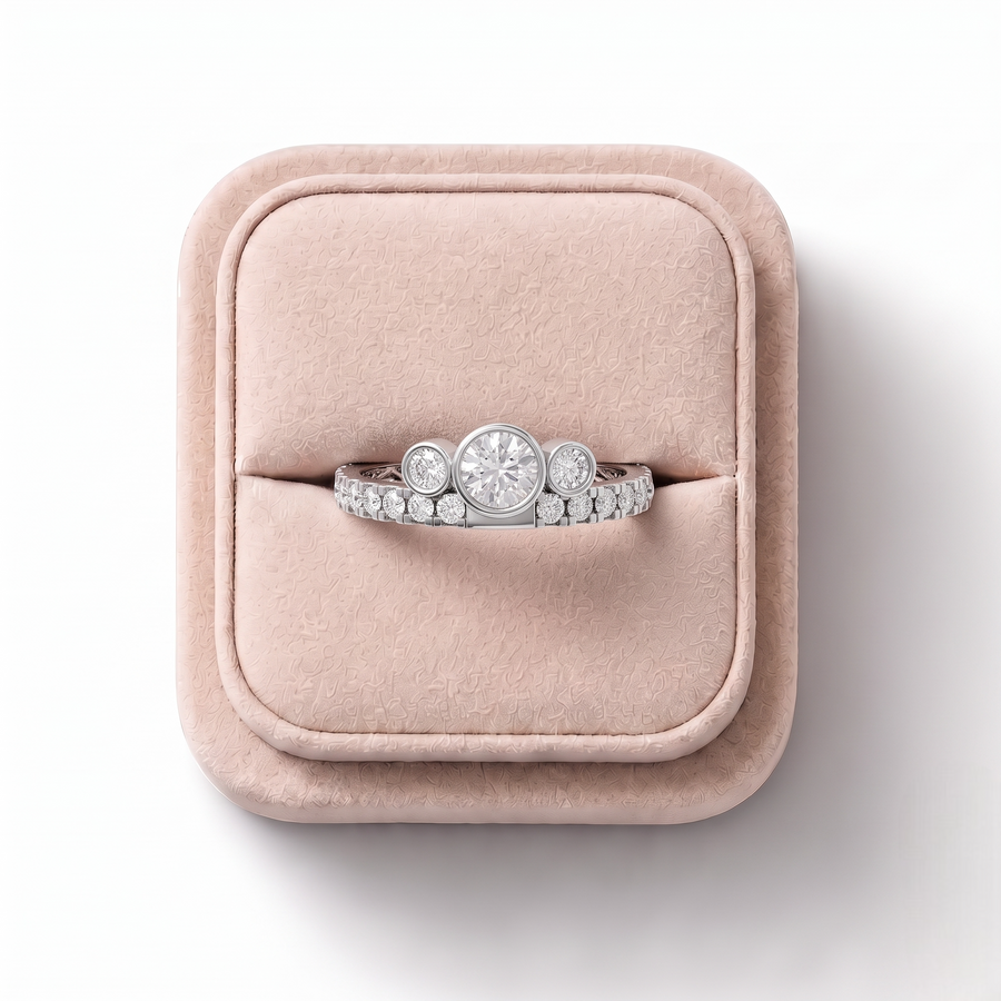 0.29 Ct Round Bezel Three-Stone Ring