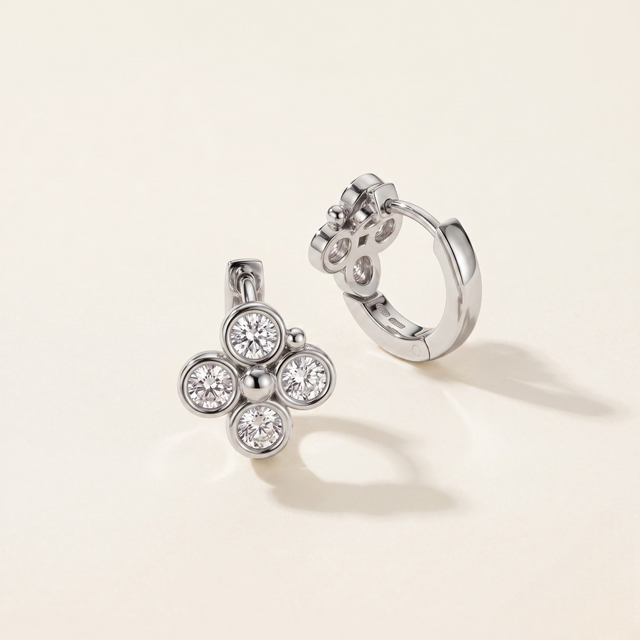 Diamond huggie earrings by Buvea