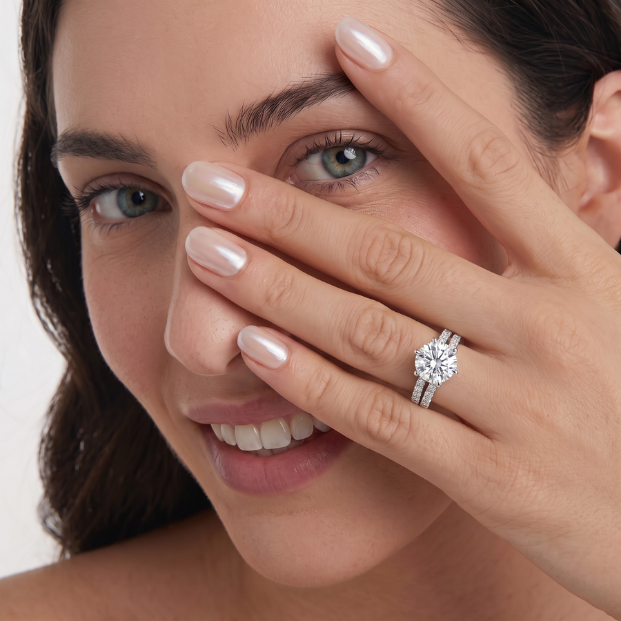 Lab grown diamond bridal set featuring a 1.5 CT round center stone with a double row of accent diamonds on a gold band.