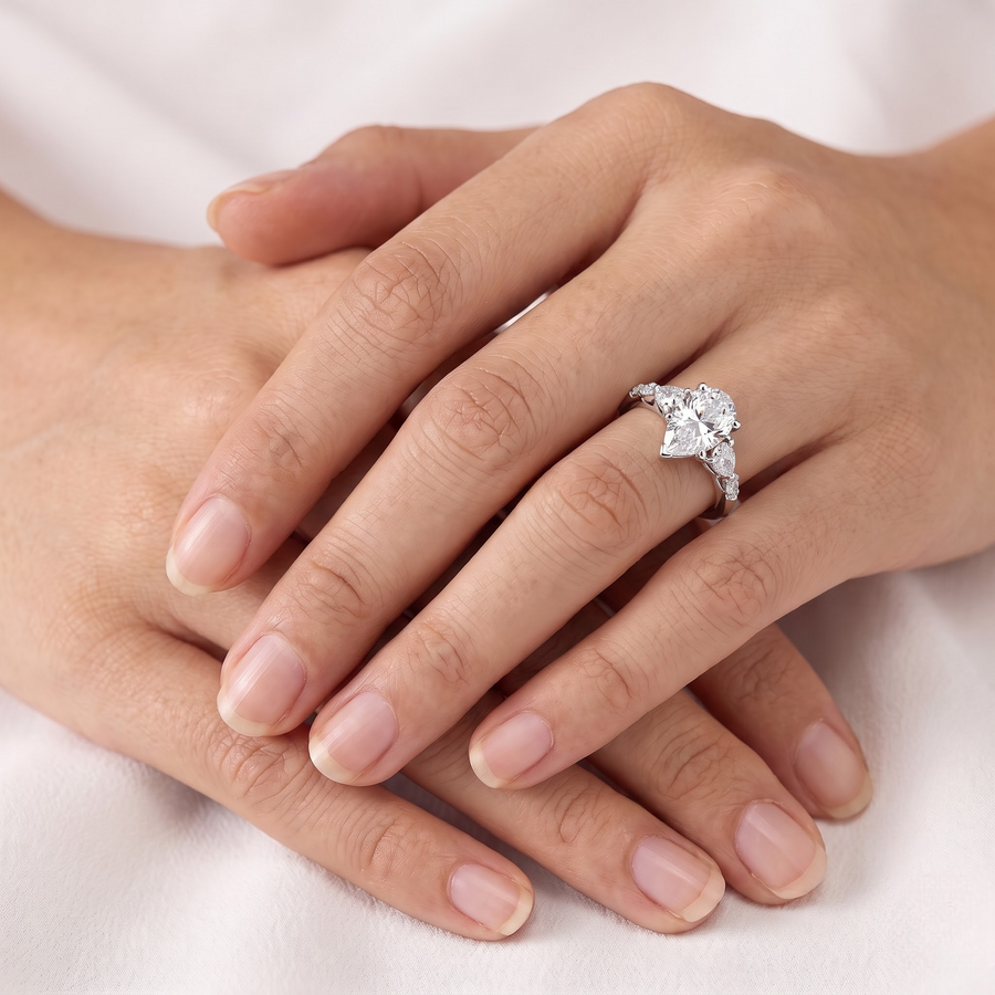 3.82 Ct Pear Three-Stone Lab Grown Diamond With Side Stone Ring