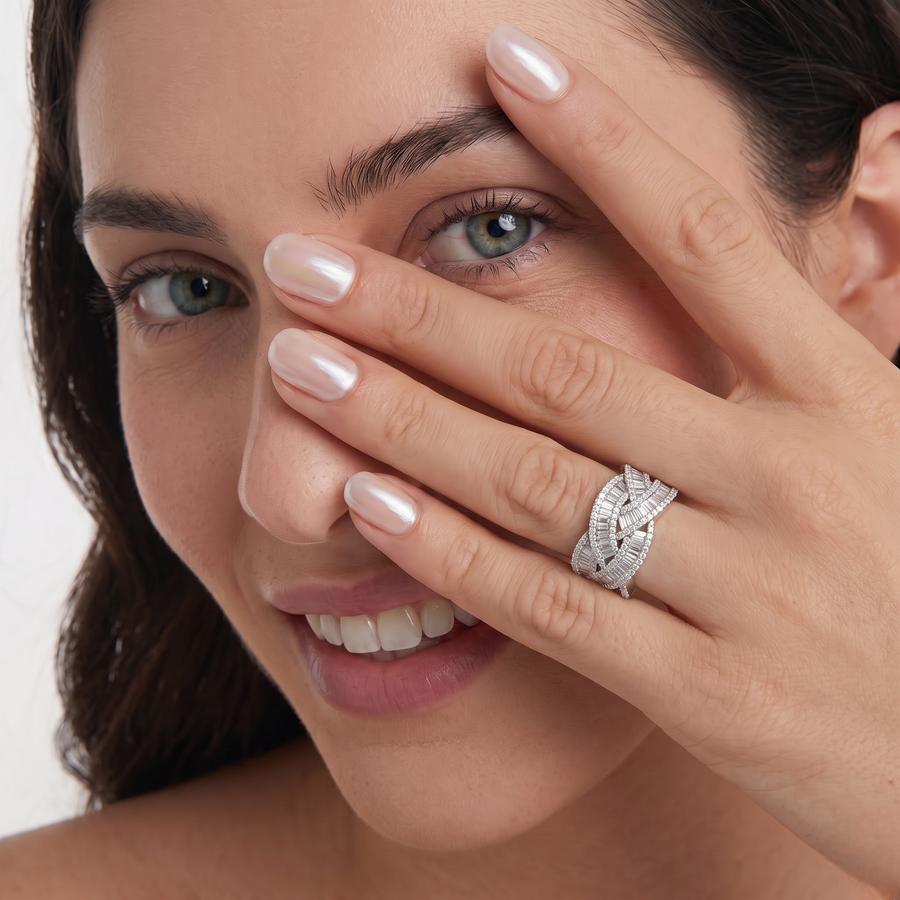 Woven multi-row baguette diamond ring featuring a mix of round and baguette stones, set in a stylish crisscross design.