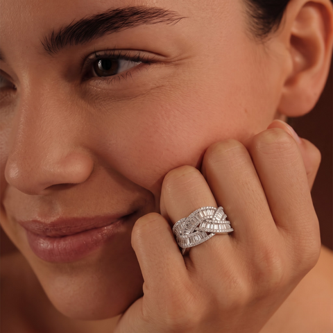 Woven multi-row ring featuring round and baguette lab-grown diamonds, showcased on a model's hand, effortlessly elegant.